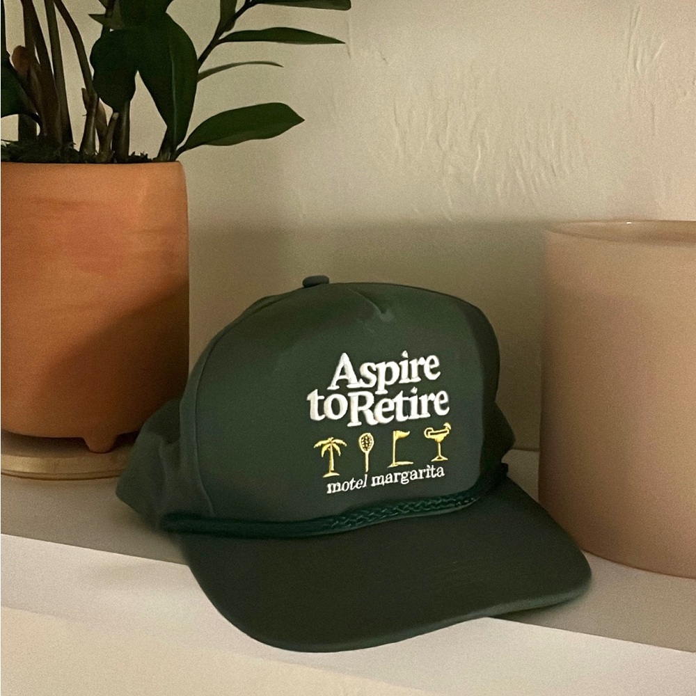 Aspire to Retire Snap Back Hat. Dark Green